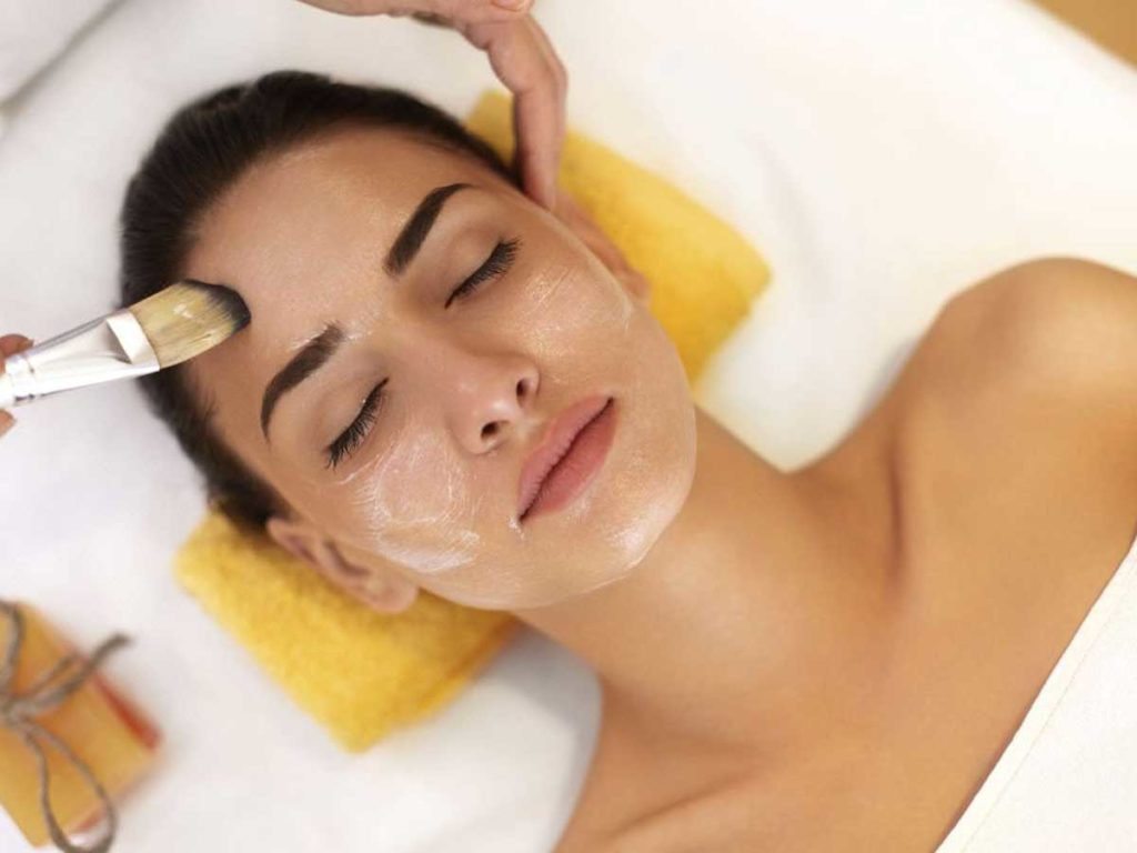 Woman at spa at L'Auberge Del Mar getting a facial